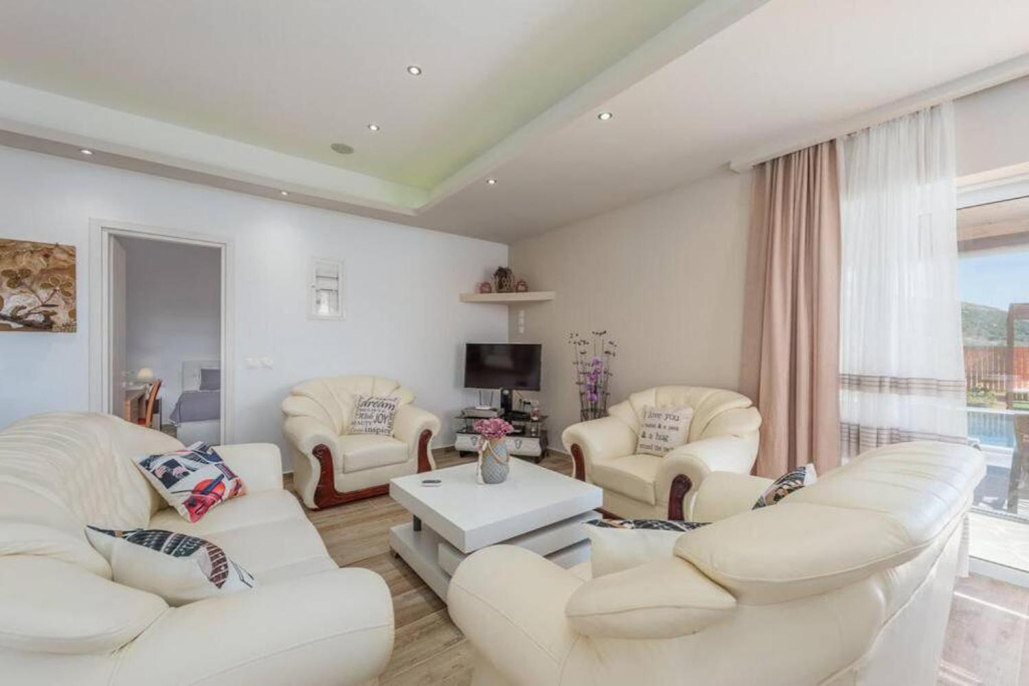 ,Open plan living room with comfortable sofas, TV, WiFi