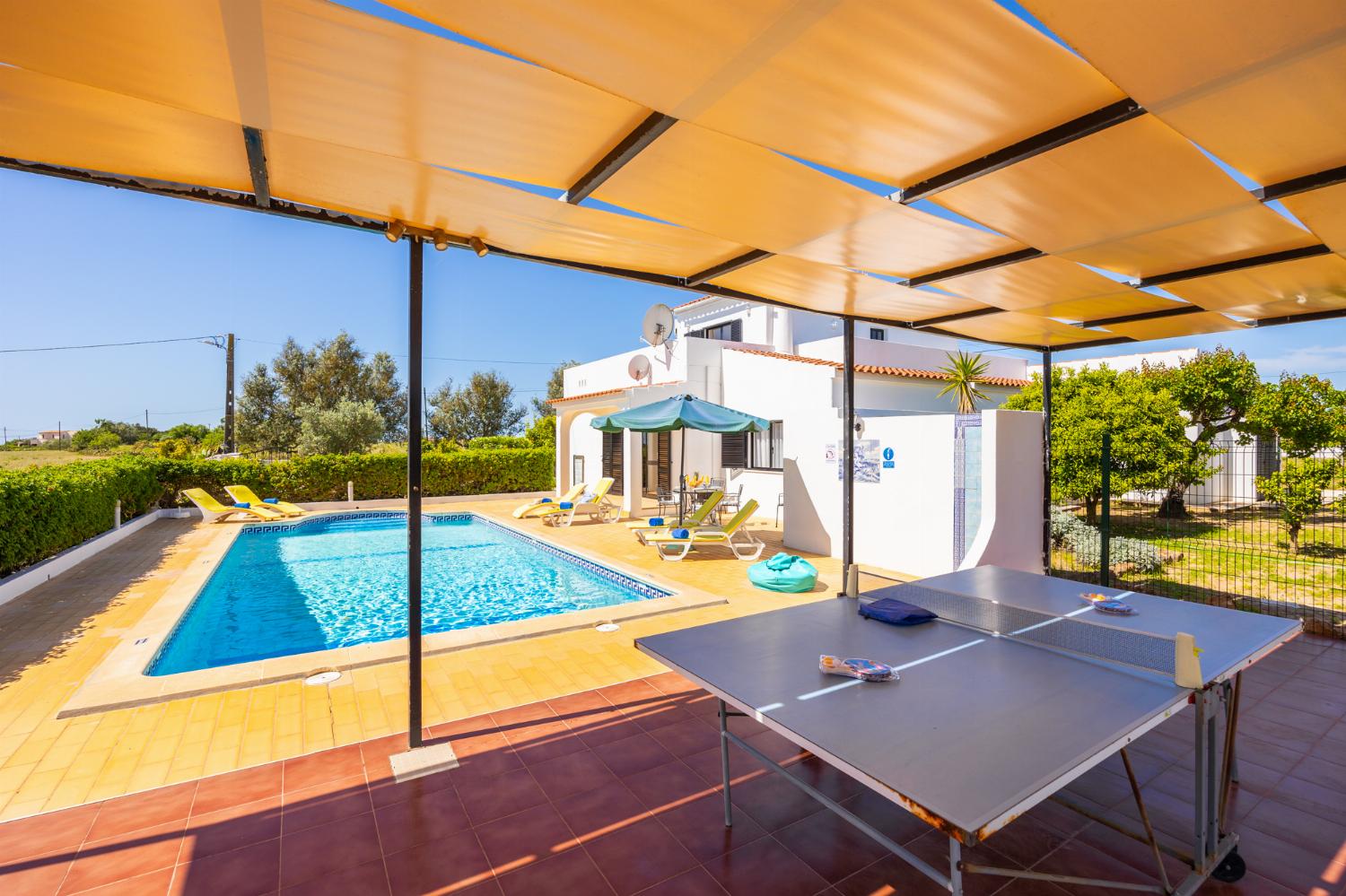 Sheltered terrace area with table tennis