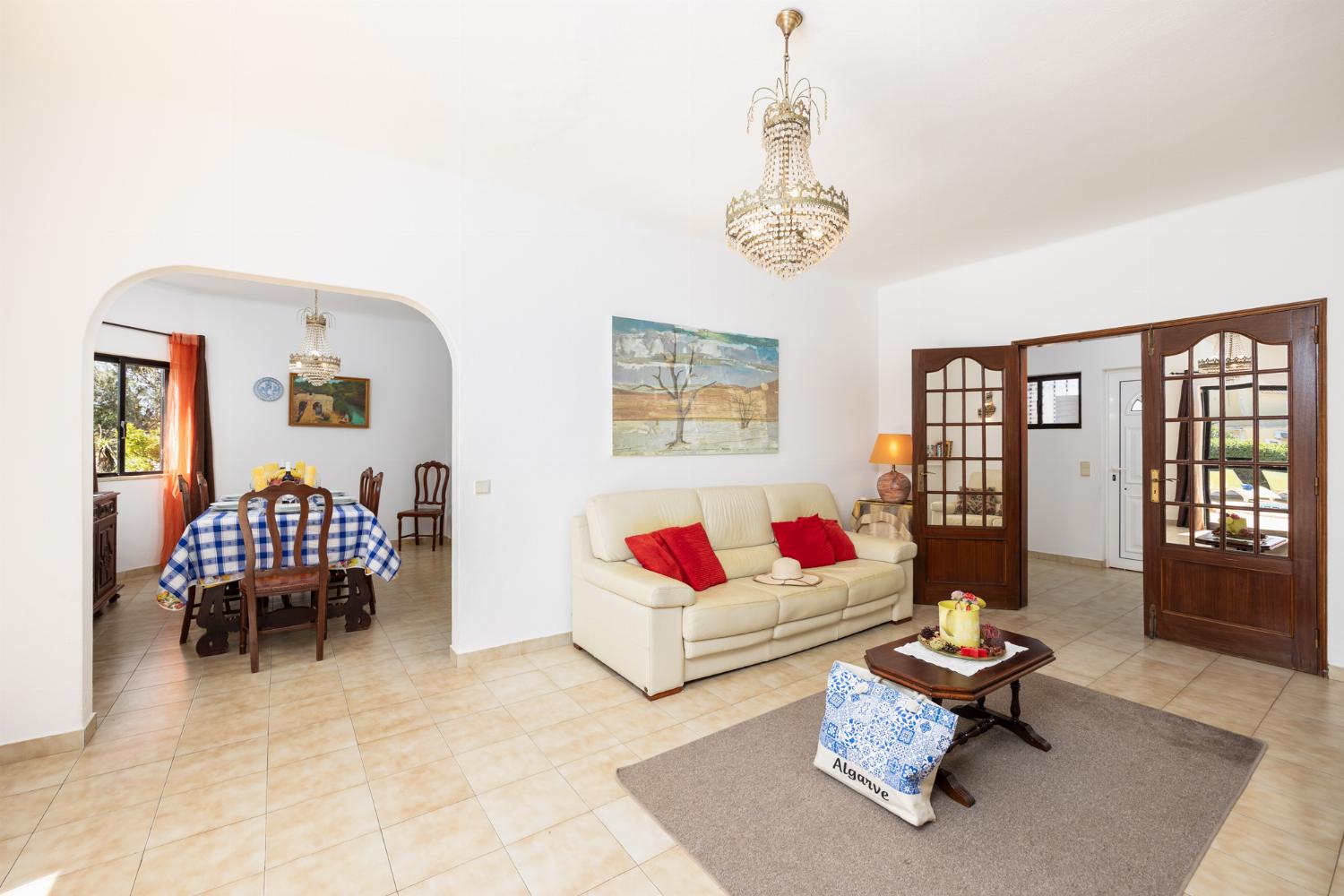 Living room with sofas, ornamental fireplace, A/C, WiFi internet, and satellite TV