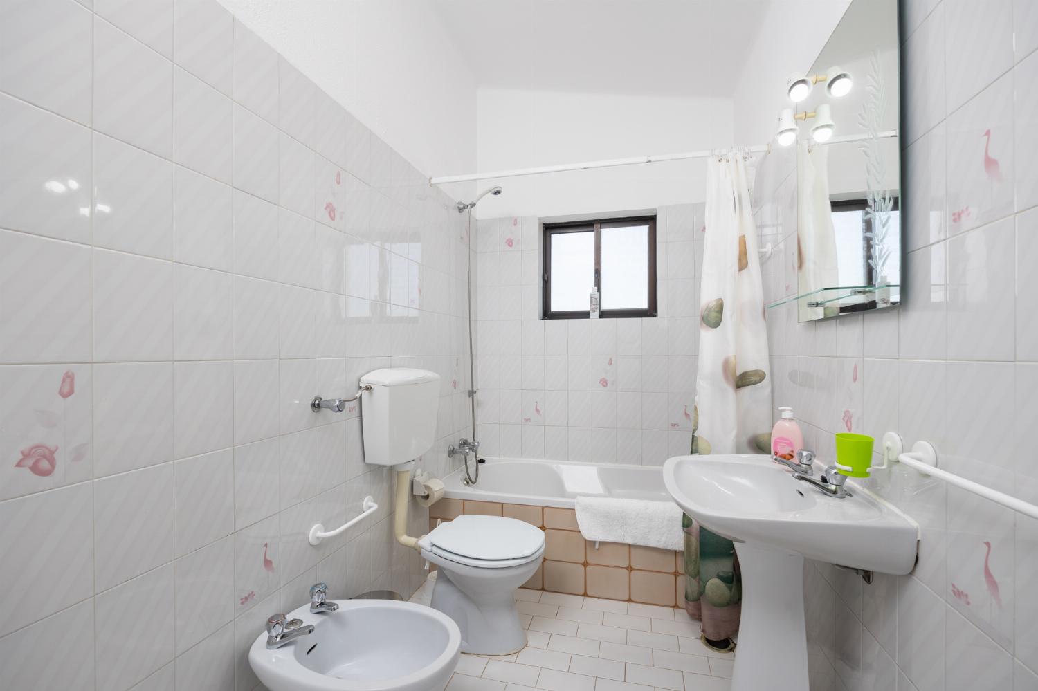 Family bathroom with bath and shower