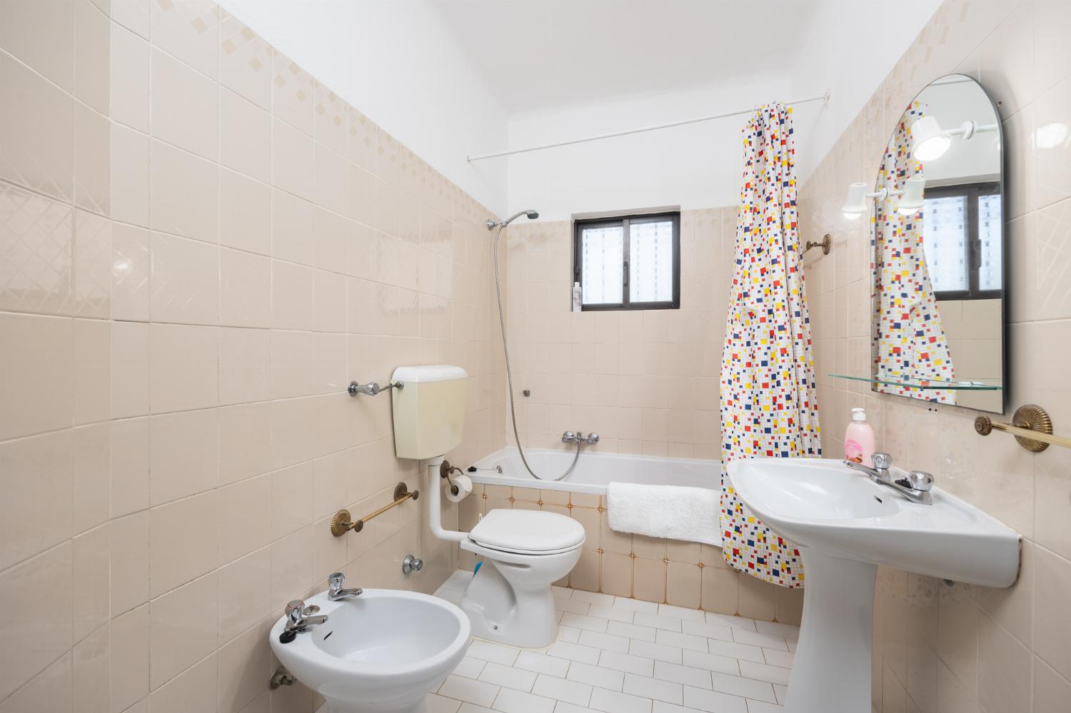 Family bathroom with bath and shower