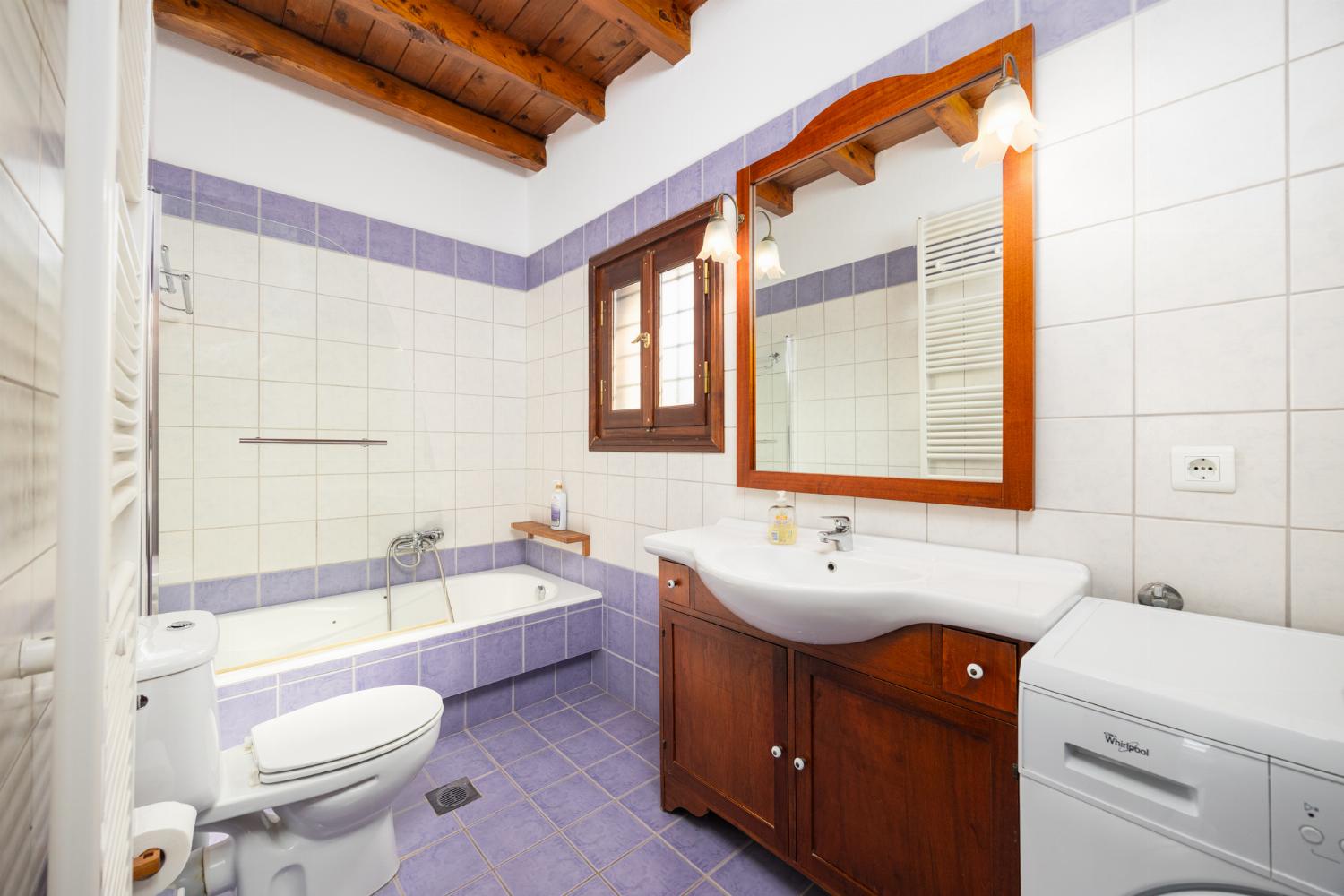 Family bathroom with bath and shower