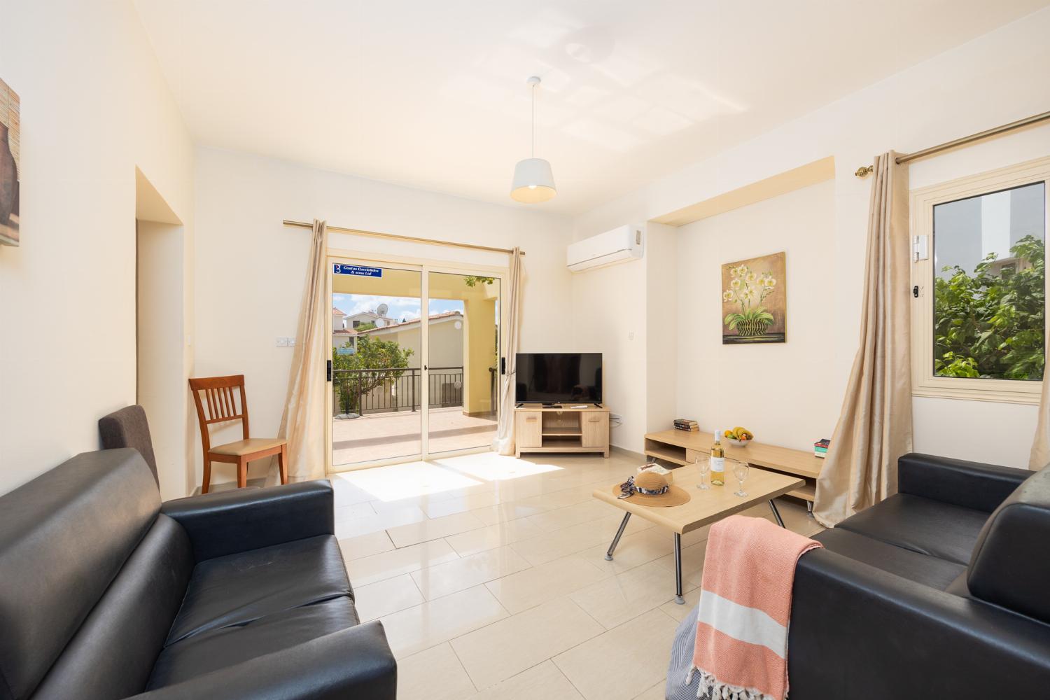 Living room with sofas, A/C, WiFi internet, and satellite TV