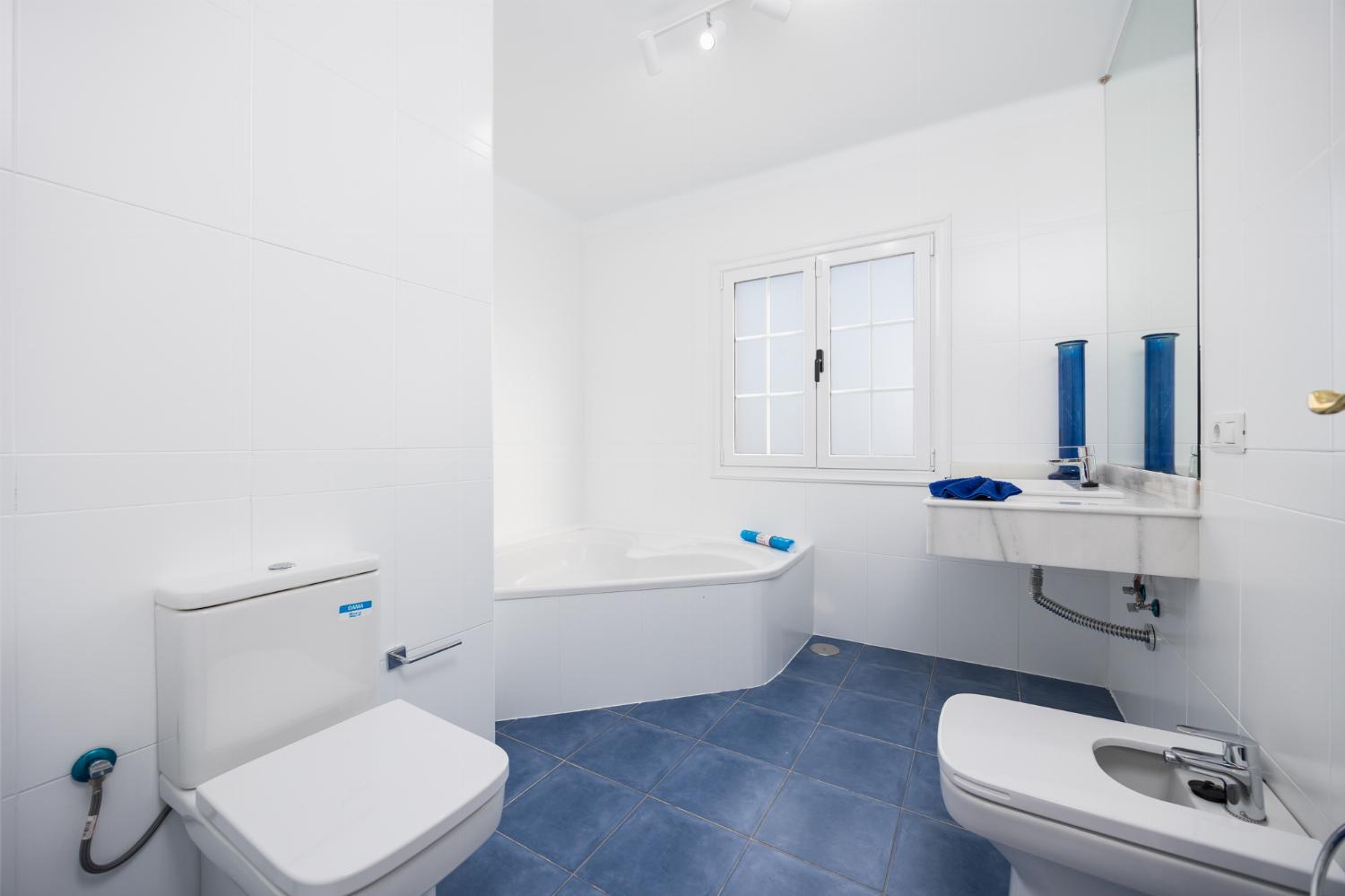 Family bathroom with bath and shower