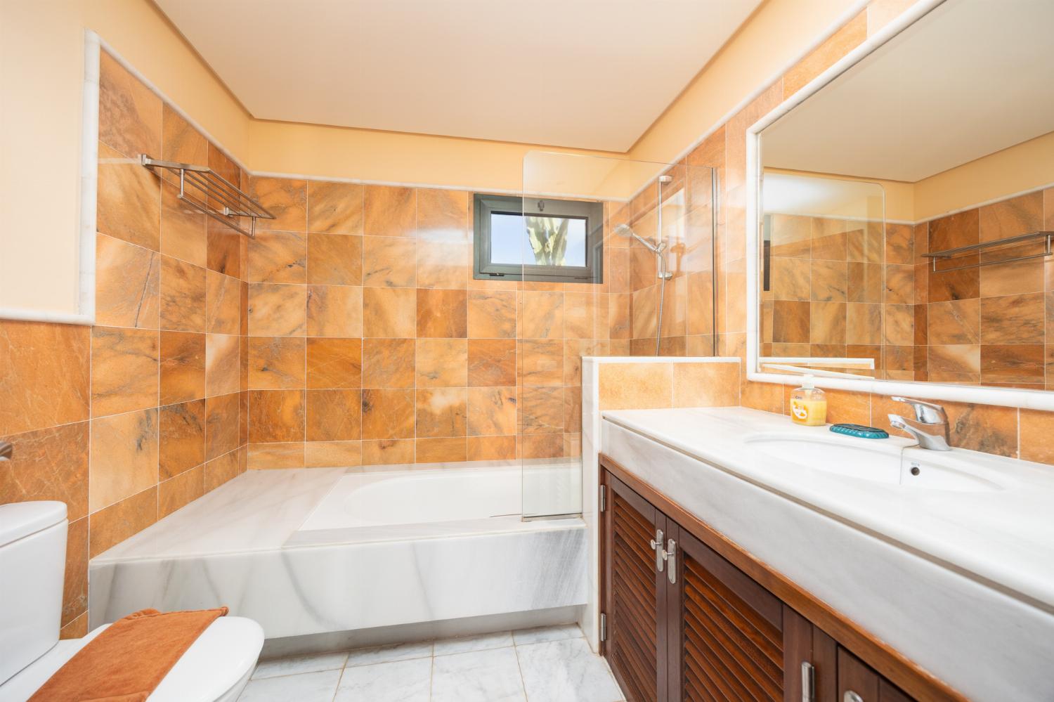 Family bathroom with bath and shower